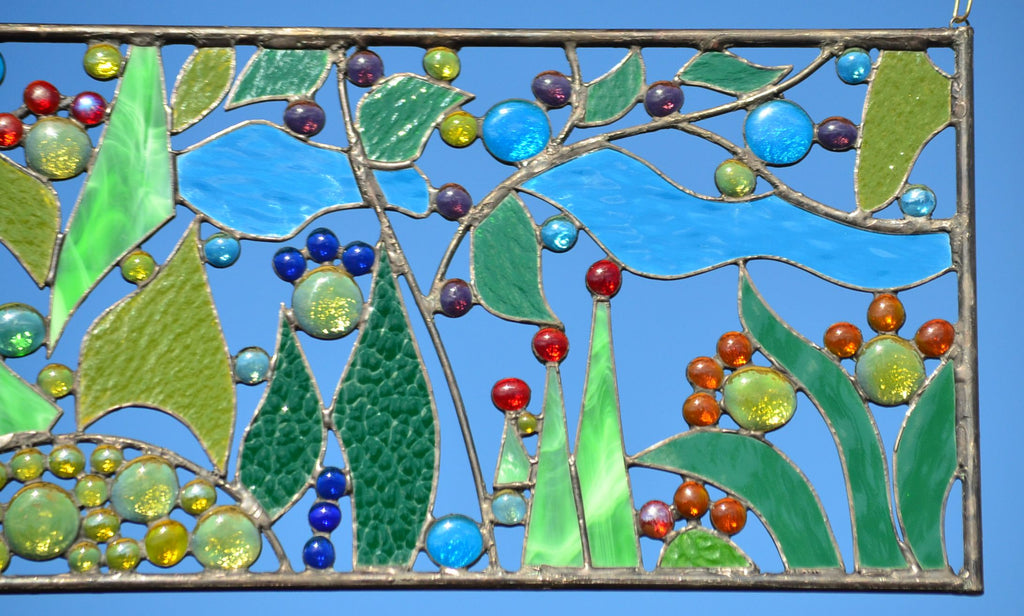 Stained glass window art of a mangrove tree in an ocean with purple and  pink flowers around the borders on Craiyon