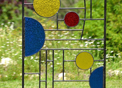 metal and stained glass yard art